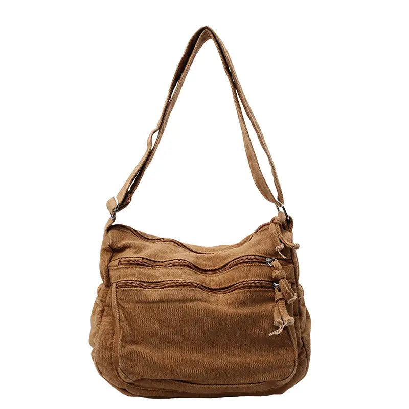 👜✨Prostorná crossbody kabelka z plátna s patinou: vyznačuje se uspořádáním s více přihrádkami na zip a širokým nastavitelným ramenním popruhem.